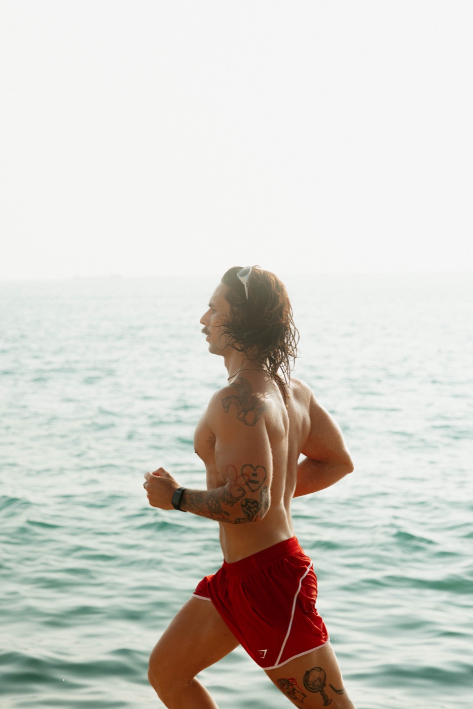 Ian Fonville running along the water